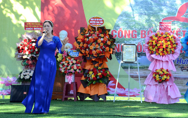 A group of women in dresses on a stageDescription automatically generated