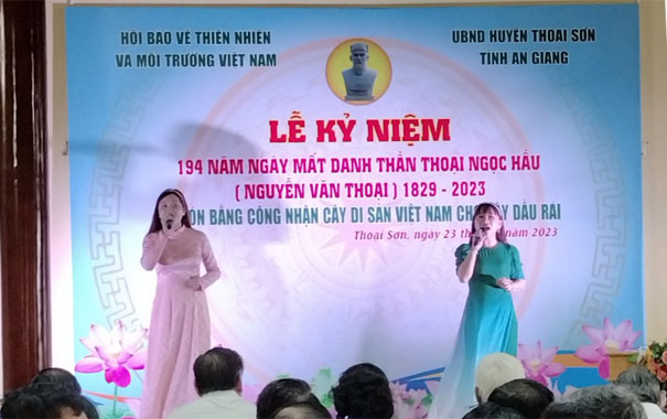 A group of women singing on a stageDescription automatically generated