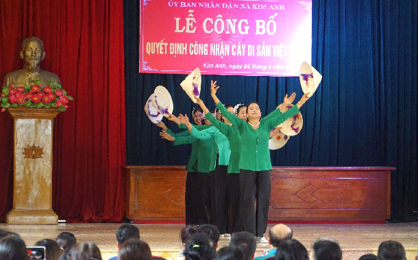 A group of women performing on stageDescription automatically generated