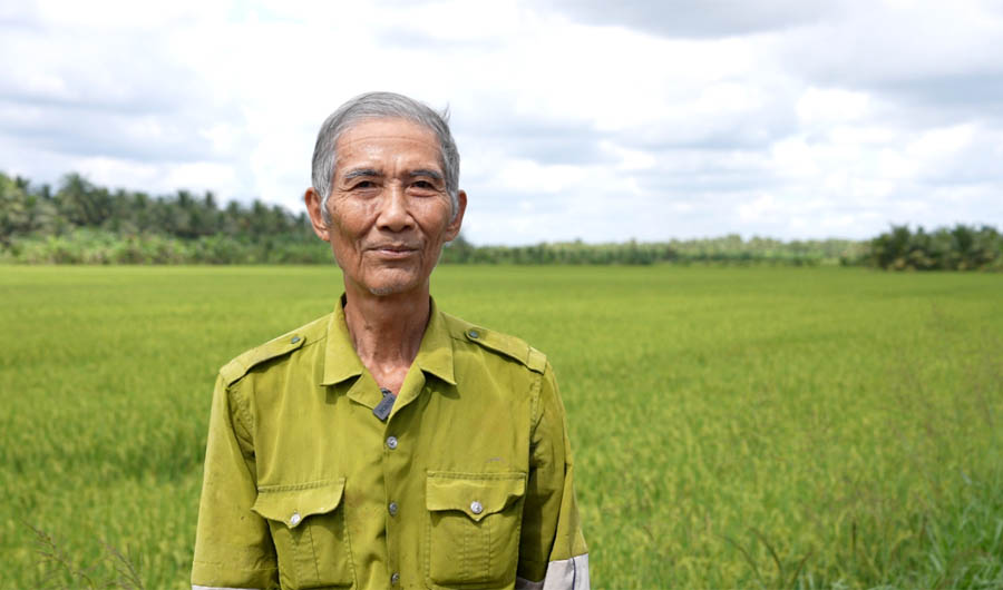 A person standing in a fieldAI-generated content may be incorrect.