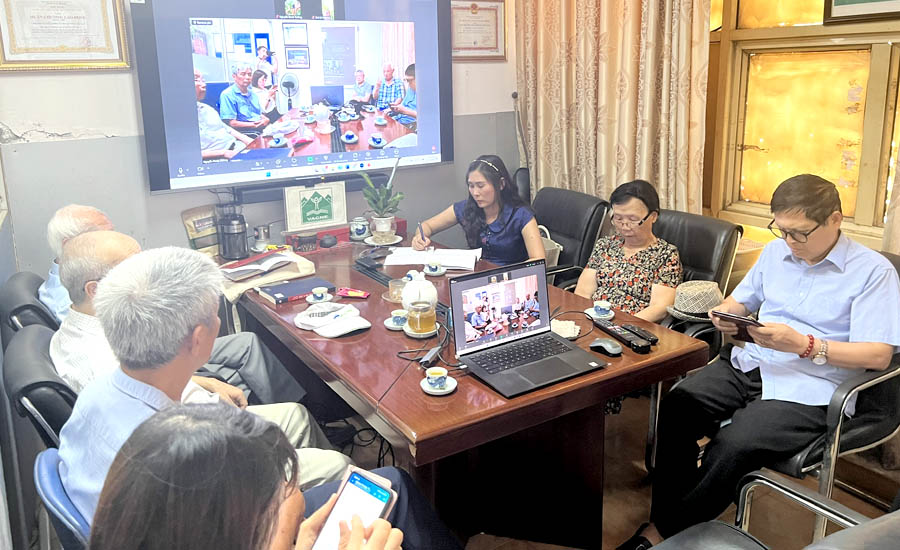 A group of people sitting around a tableAI-generated content may be incorrect.
