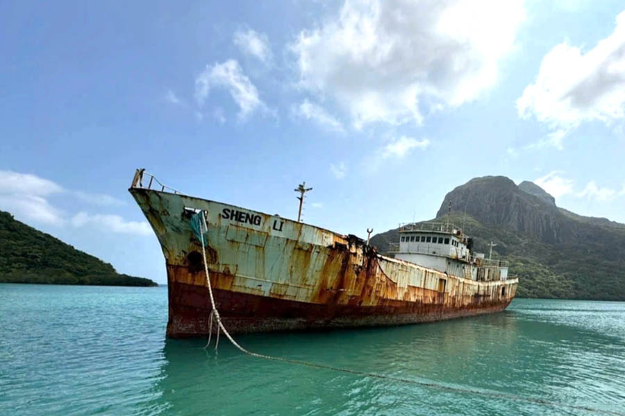 A rusty ship in the waterAI-generated content may be incorrect.