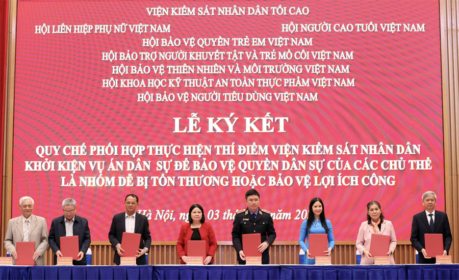 A group of people standing on a stage holding papersAI-generated content may be incorrect.