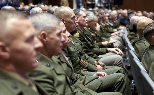 Two men in military uniformsAI-generated content may be incorrect.